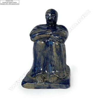 navy glazed seated man. An early example of New Zealand pottery. H.140mm - Jack Hutchison