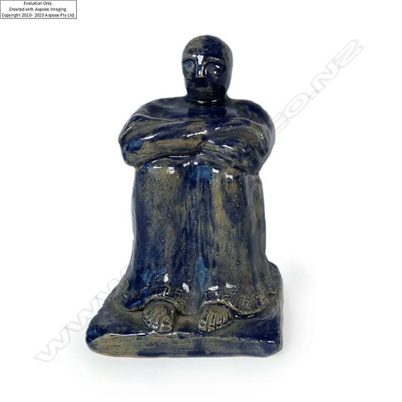 navy glazed seated man. An early example of New Zealand pottery. H.140mm - Jack Hutchison