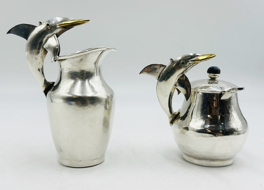Artwork by Los Castillo, Pitcher and Lidded Pot with Dolphin Handles by Los Castillo, 20th Century Mexico, Made of silver & brass