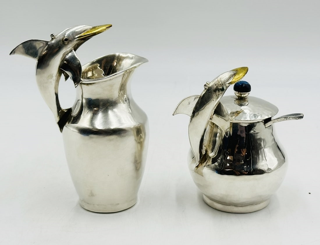 Artwork by Los Castillo, Pitcher and Lidded Pot with Dolphin Handles by Los Castillo, 20th Century Mexico, Made of silver & brass