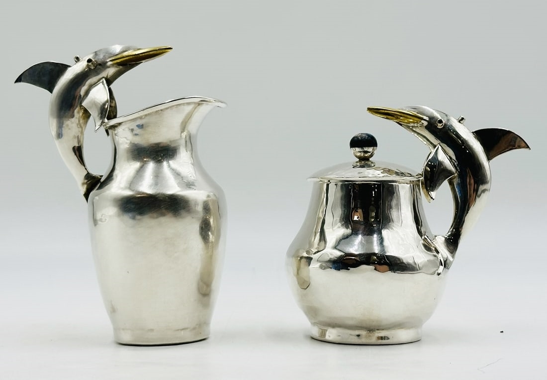 Artwork by Los Castillo, Pitcher and Lidded Pot with Dolphin Handles by Los Castillo, 20th Century Mexico, Made of silver & brass