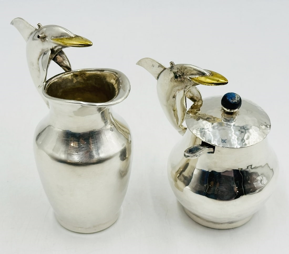 Artwork by Los Castillo, Pitcher and Lidded Pot with Dolphin Handles by Los Castillo, 20th Century Mexico, Made of silver & brass