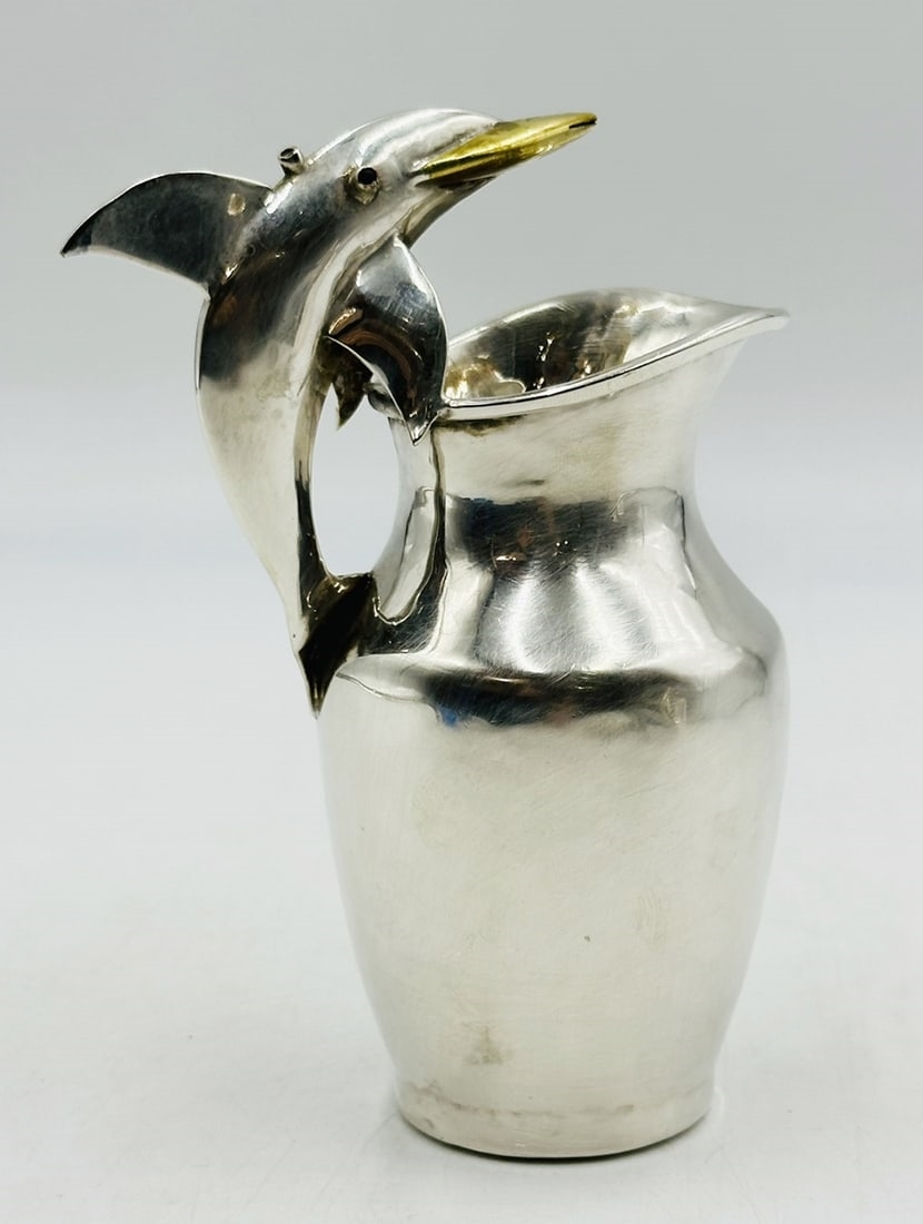 Artwork by Los Castillo, Pitcher and Lidded Pot with Dolphin Handles by Los Castillo, 20th Century Mexico, Made of silver & brass