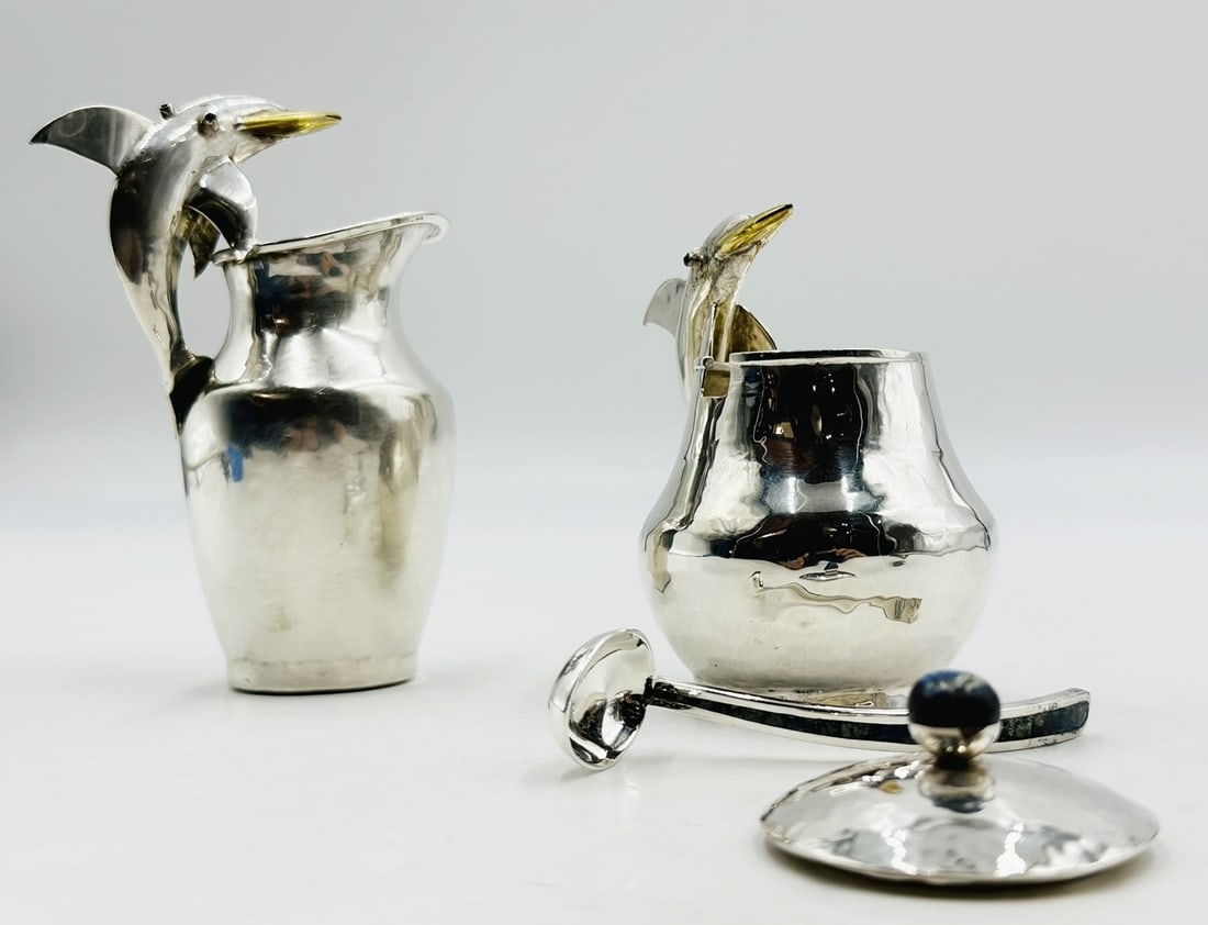 Artwork by Los Castillo, Pitcher and Lidded Pot with Dolphin Handles by Los Castillo, 20th Century Mexico, Made of silver & brass