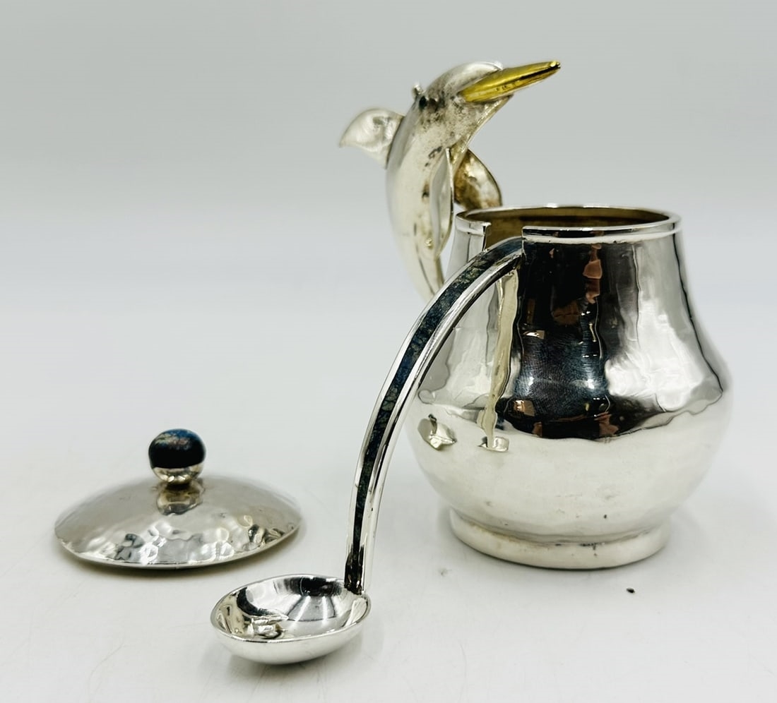 Artwork by Los Castillo, Pitcher and Lidded Pot with Dolphin Handles by Los Castillo, 20th Century Mexico, Made of silver & brass