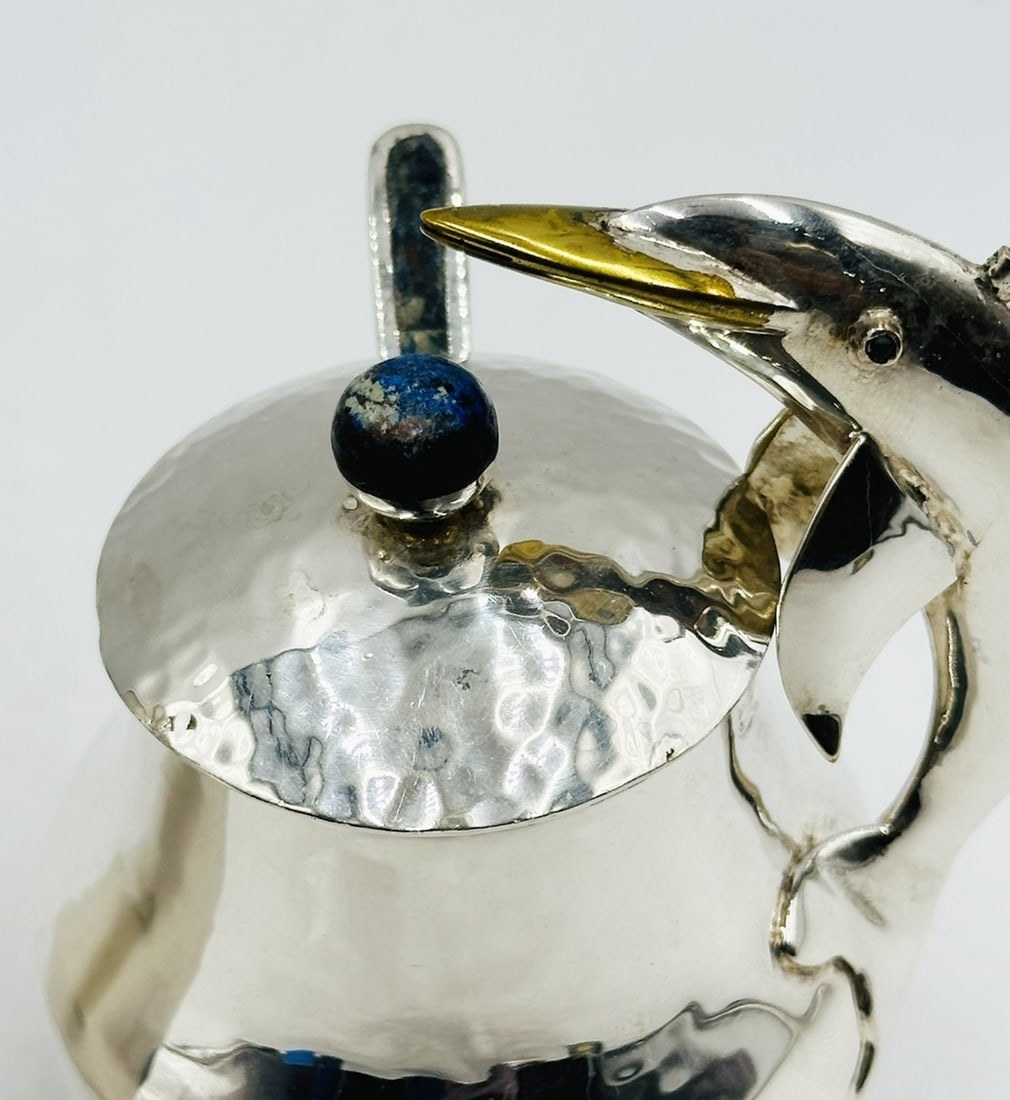 Artwork by Los Castillo, Pitcher and Lidded Pot with Dolphin Handles by Los Castillo, 20th Century Mexico, Made of silver & brass