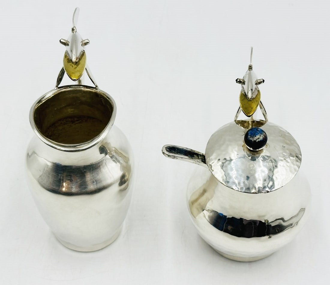 Artwork by Los Castillo, Pitcher and Lidded Pot with Dolphin Handles by Los Castillo, 20th Century Mexico, Made of silver & brass