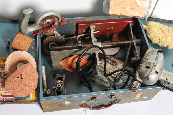 Artwork by MANUAL, A vintage Lightburn rotary saw with instruction manual in original metal case, Made of metal