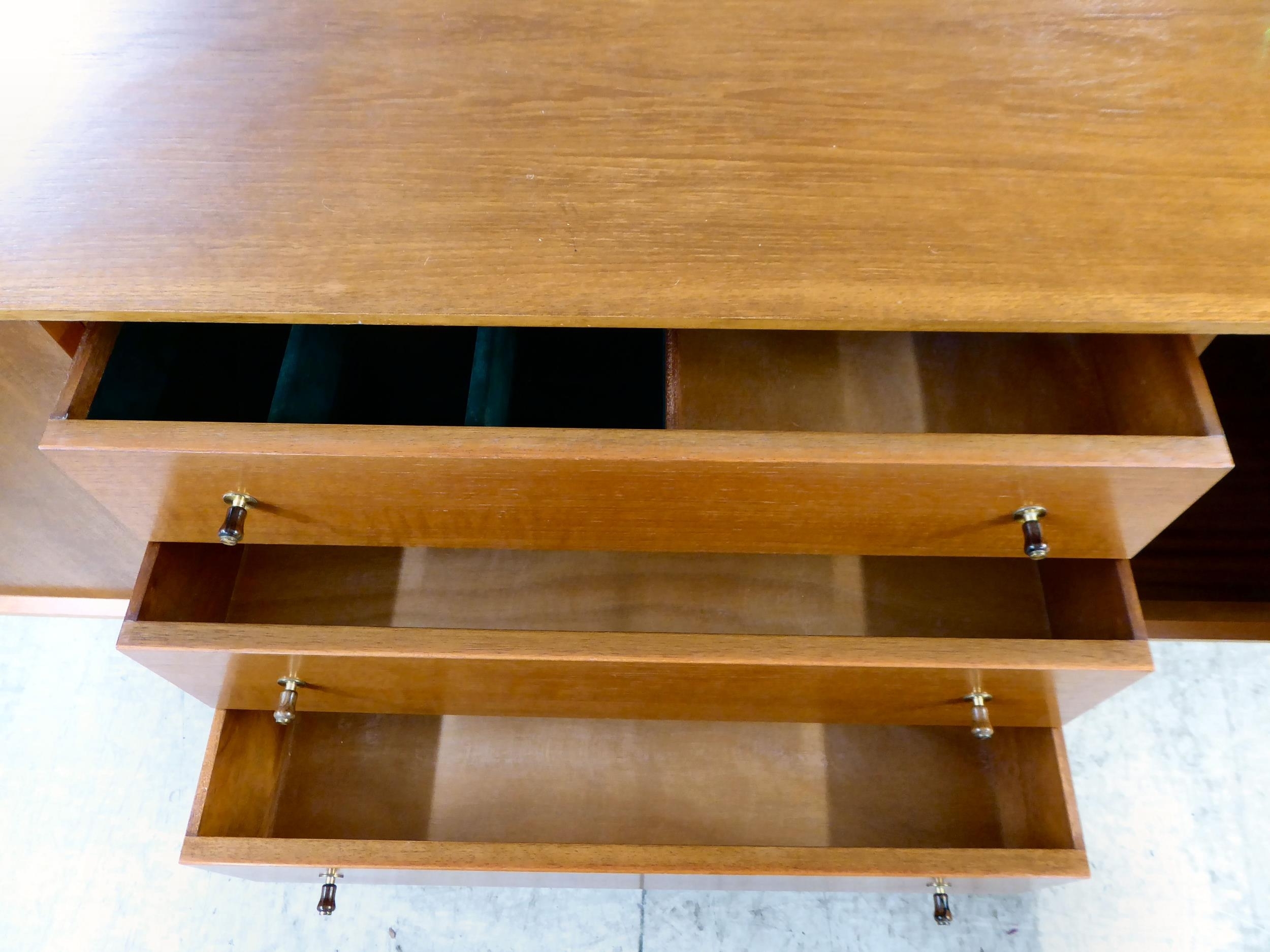 Gordon Russell | A Gordon Russell teak sideboard with a bank of three ...