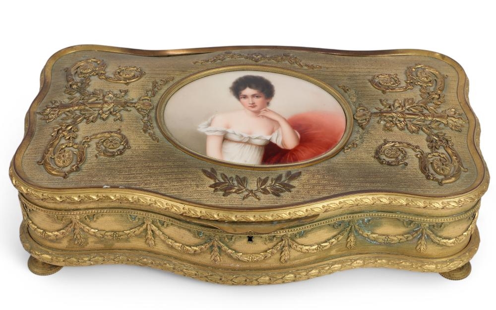 Rubbing | A French porcelain mounted gilt metal table box (Early 20th ...