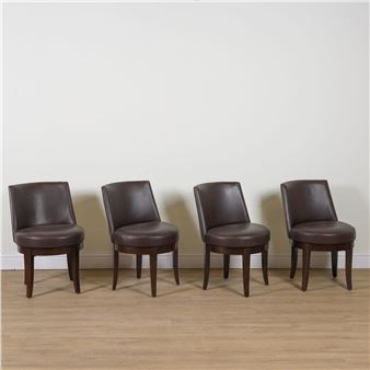 PHILLIPEE HUREL; A SET OF FOUR BROWN LEATHER UPHOLSTERED TUB BACK OFFICE CHAIRS - Philippe Hurel