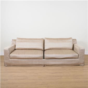 CHRISTIAN LIAIGRE; A GOLD UPHOLSTERED SQUARE BACK SOFA - Christian Liaigre