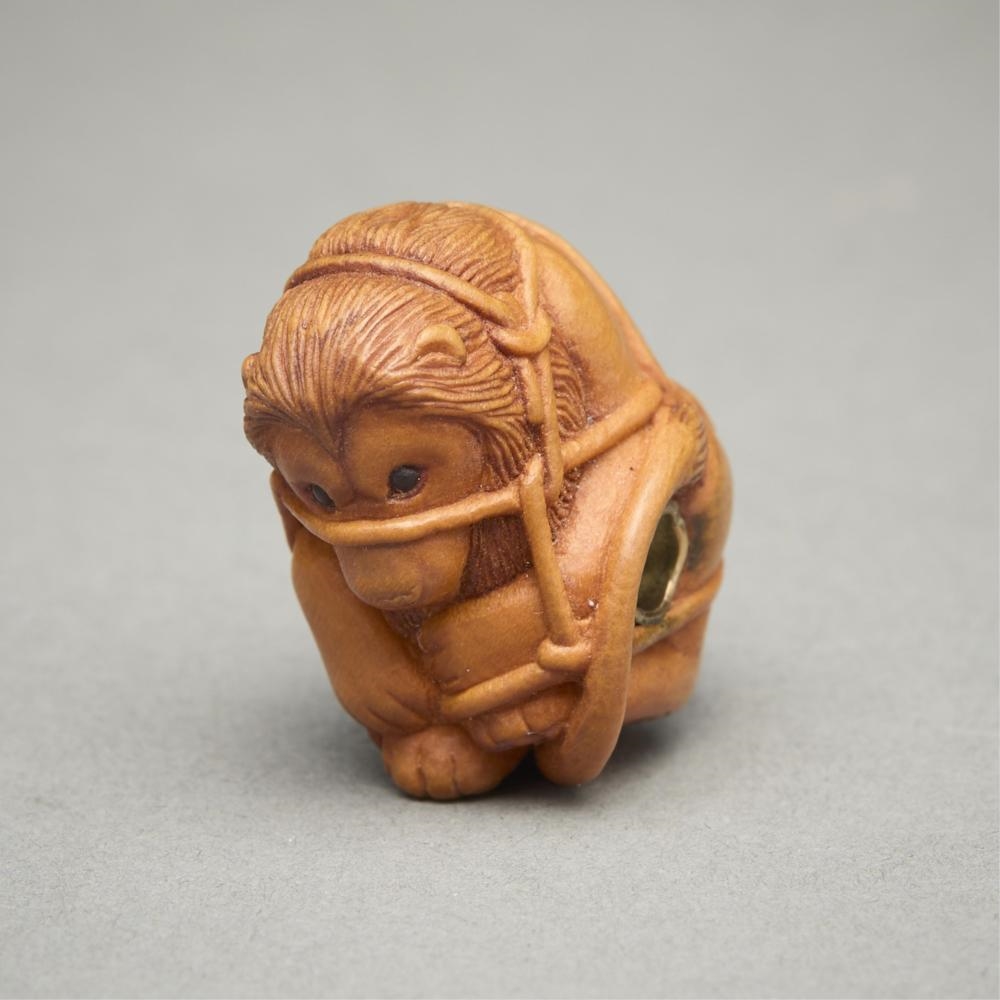 Artwork by Susan Wraight, Aslan Bound, Made of Stained European boxwood ojime carving