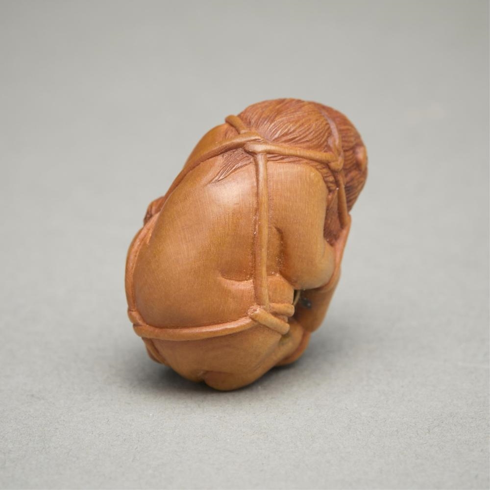 Artwork by Susan Wraight, Aslan Bound, Made of Stained European boxwood ojime carving