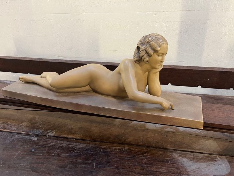Artwork by Bohumil Rezl, Reclining nude, Made of polychrome terracotta