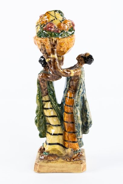 Artwork by Gaston Broquet, The load  group Manufacture Henriot Quimper, Made of Polychrome glazed earthenware