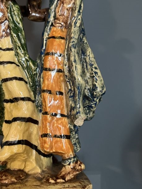 Artwork by Gaston Broquet, The load  group Manufacture Henriot Quimper, Made of Polychrome glazed earthenware