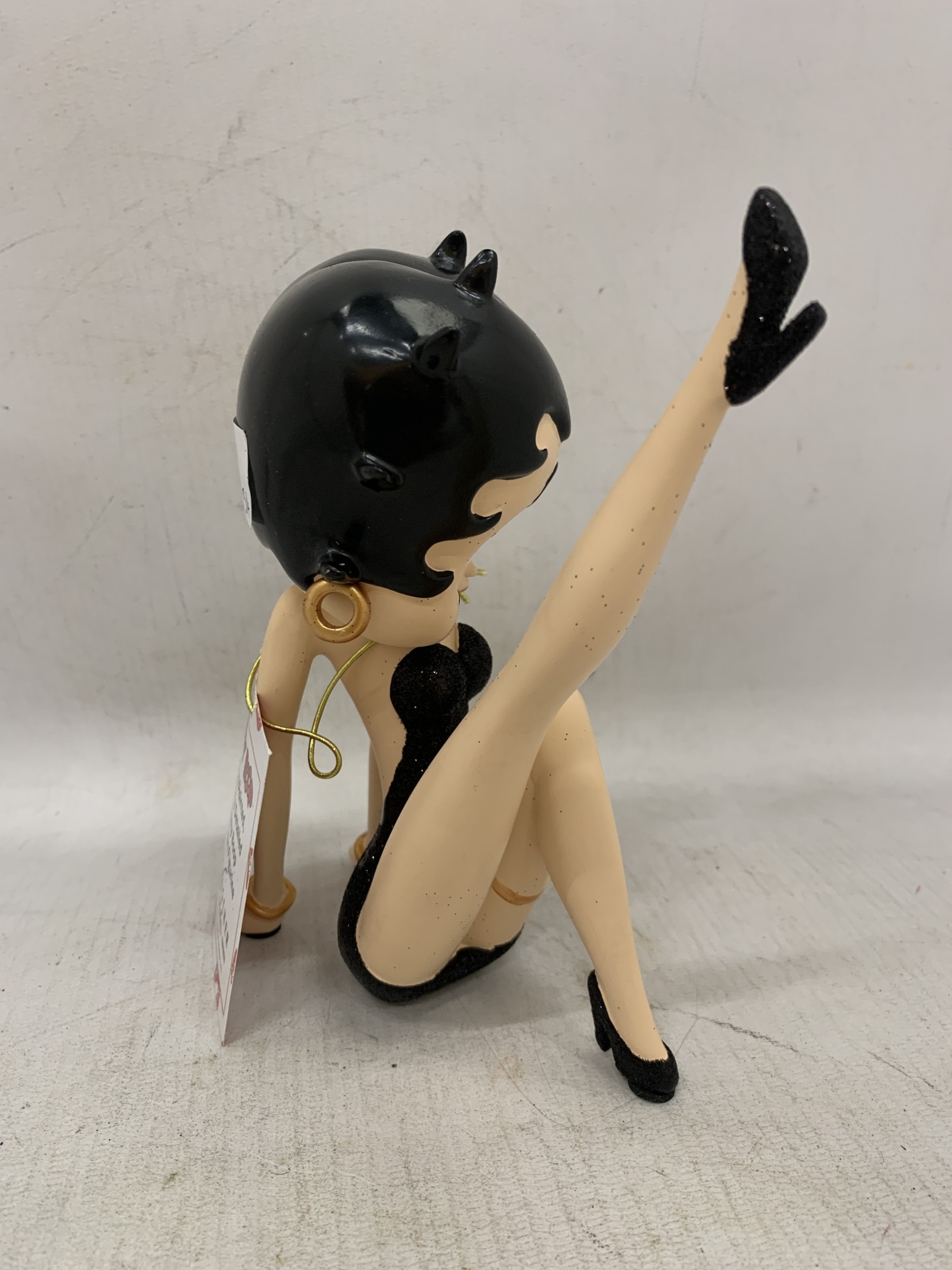 Artwork by Betty, A BETTY BOOP FIGURE WEARING A BLACK GLITTER DRESS, Made of BLACK GLITTER