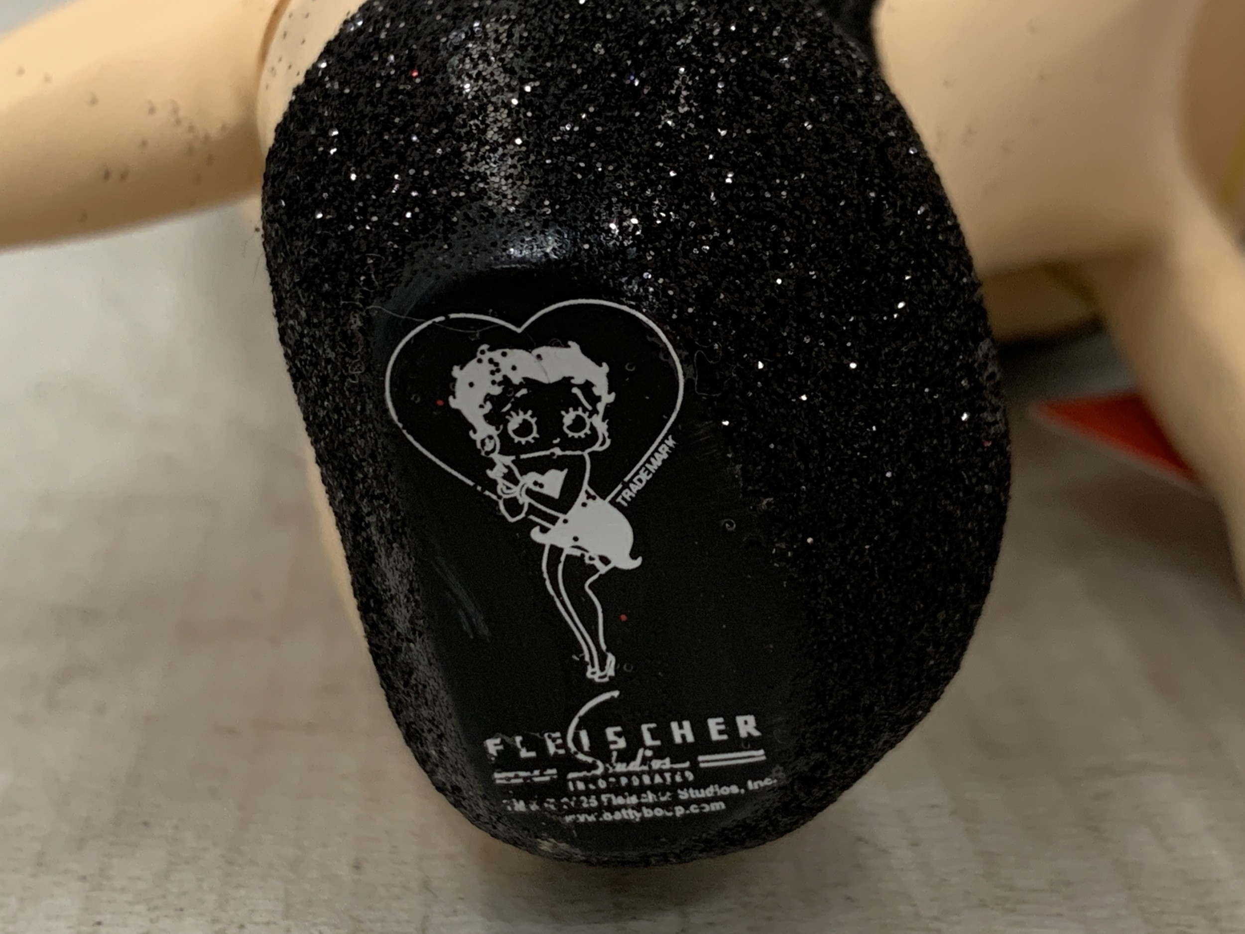 Artwork by Betty, A BETTY BOOP FIGURE WEARING A BLACK GLITTER DRESS, Made of BLACK GLITTER
