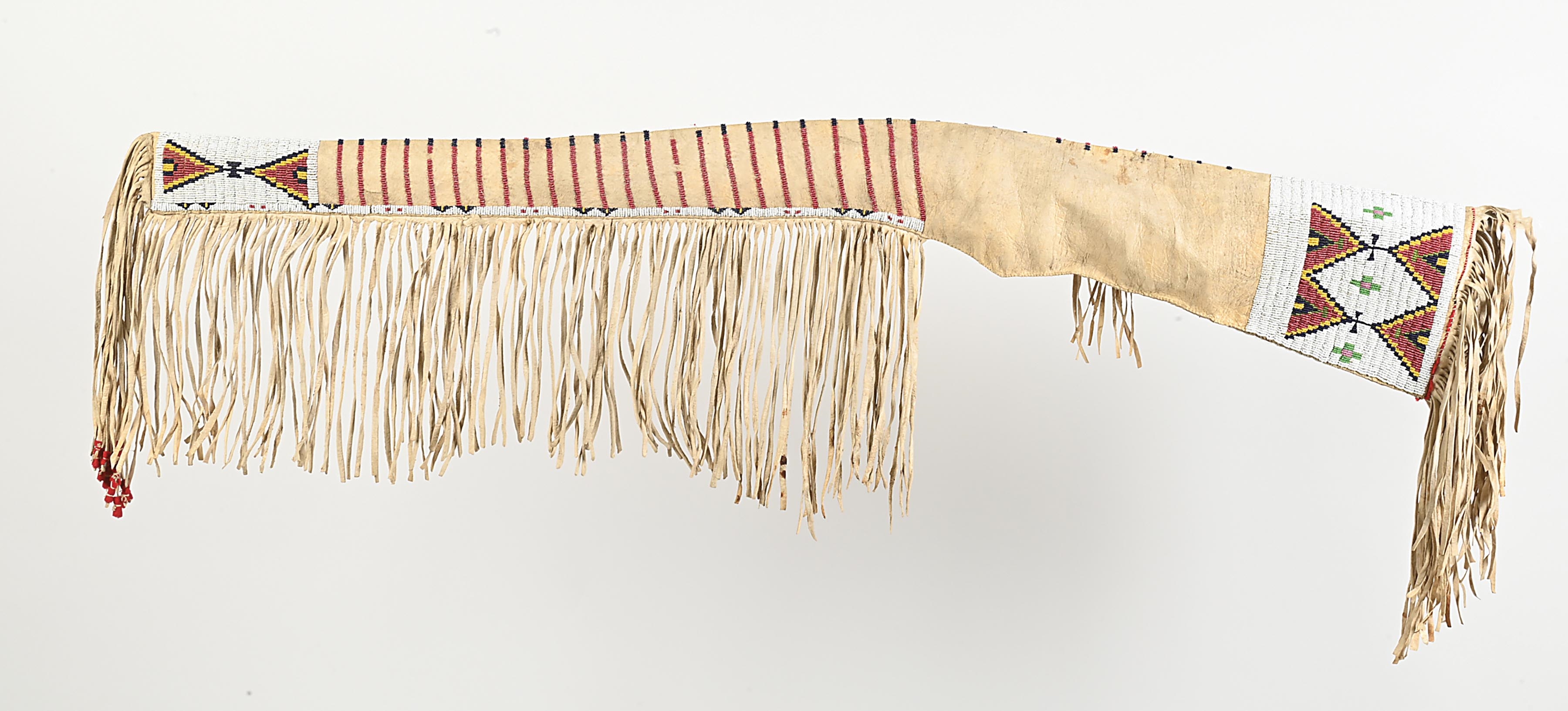 Fringe | A beaded and fringed rifle scabbard with crosses and geometric ...