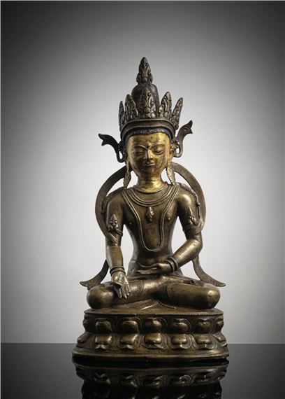 A LARGE BRONZE FIGURE OF RATNASAMBHAVA by Tibetan School, 14th Century, Tibet, 14th cent.