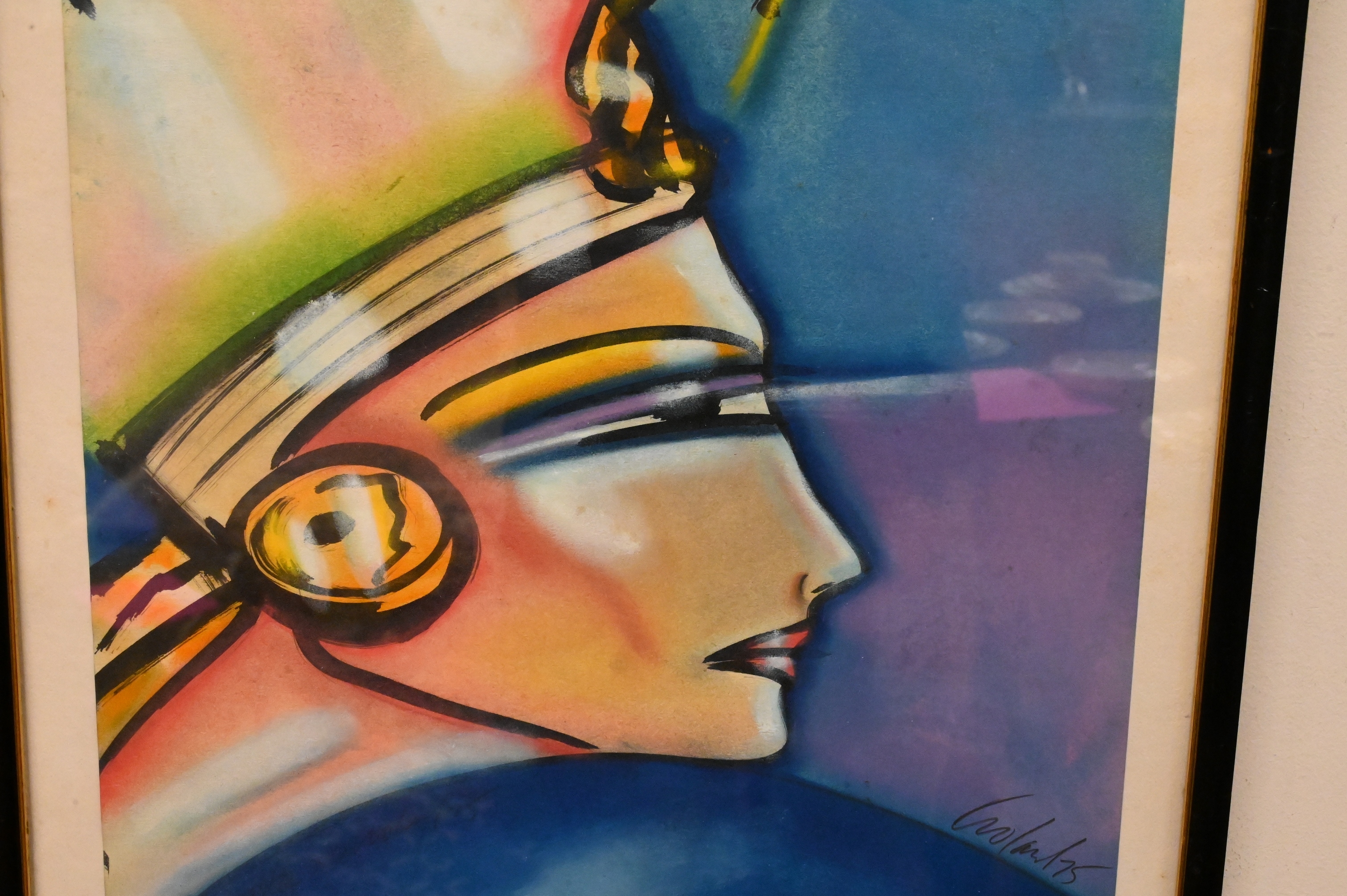 A stylized profile portrait of a figure wearing an elaborate headdress against a blue background.