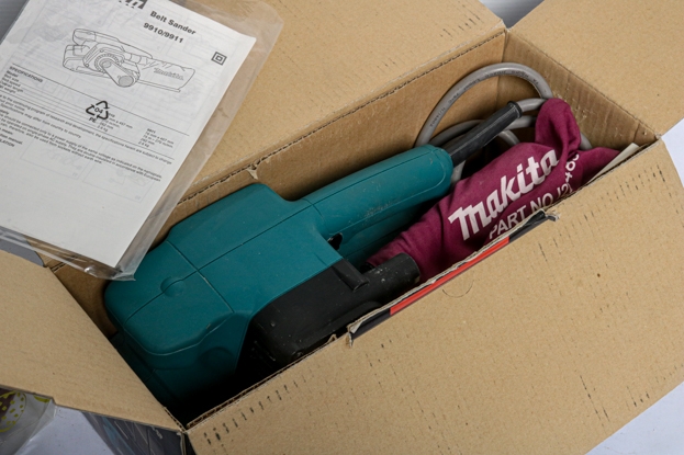 Artwork by MANUAL, A Makita corded 75mm belt sander 9910-sp, Made of sand