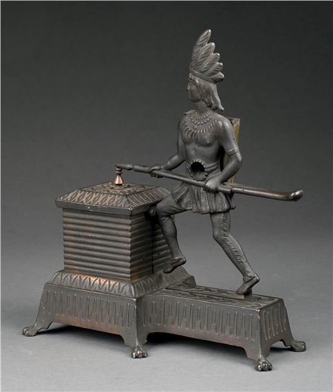 Fantastic example of this Indian cigar cutter by Monroe Manufacturing Company. Would work by placing a cigar in the Indian's stomach and then depressing the lever. The cigar tip gets trimmed and a match is ejected from the reservoir. As the match is ejected, it strikes the saw teeth, lighting it. Considered to be the epitome of a figural cast iron cigar cutter - Cutter