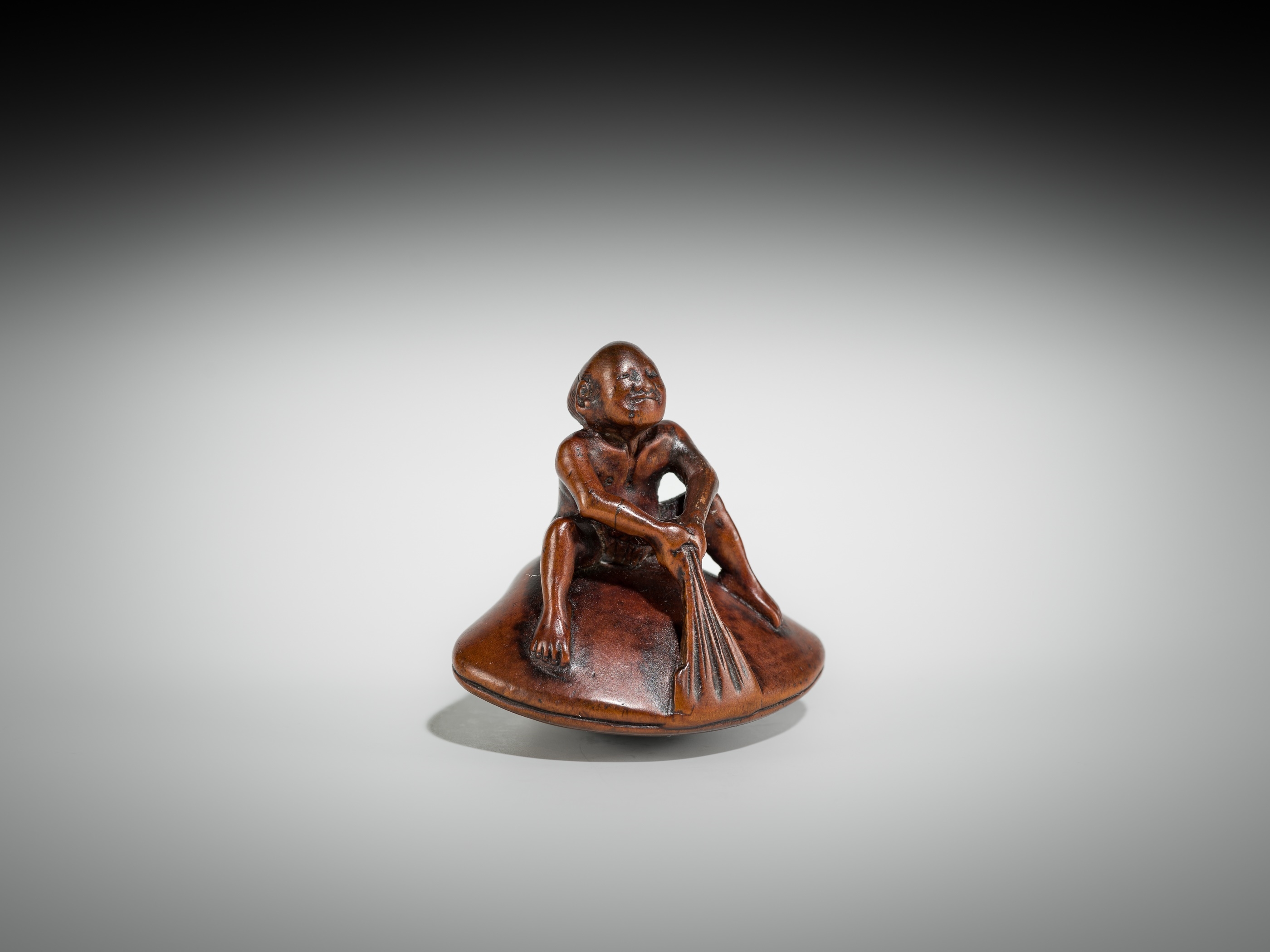 Gyokusai | GYOKUSAI: A FINE WOOD SHUNGA NETSUKE OF MAN ON A HAMAGURI ...