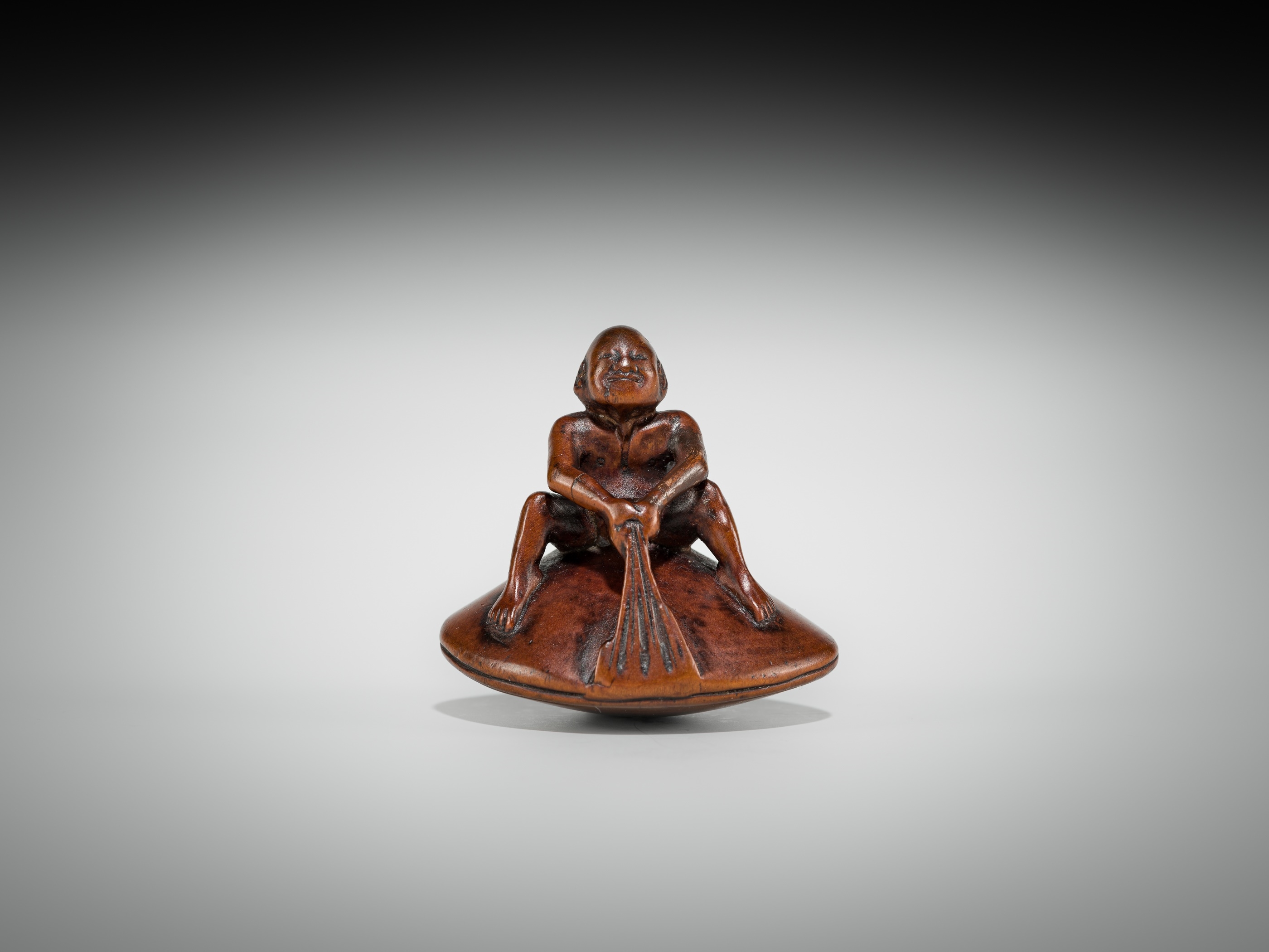 Gyokusai | GYOKUSAI: A FINE WOOD SHUNGA NETSUKE OF MAN ON A HAMAGURI ...