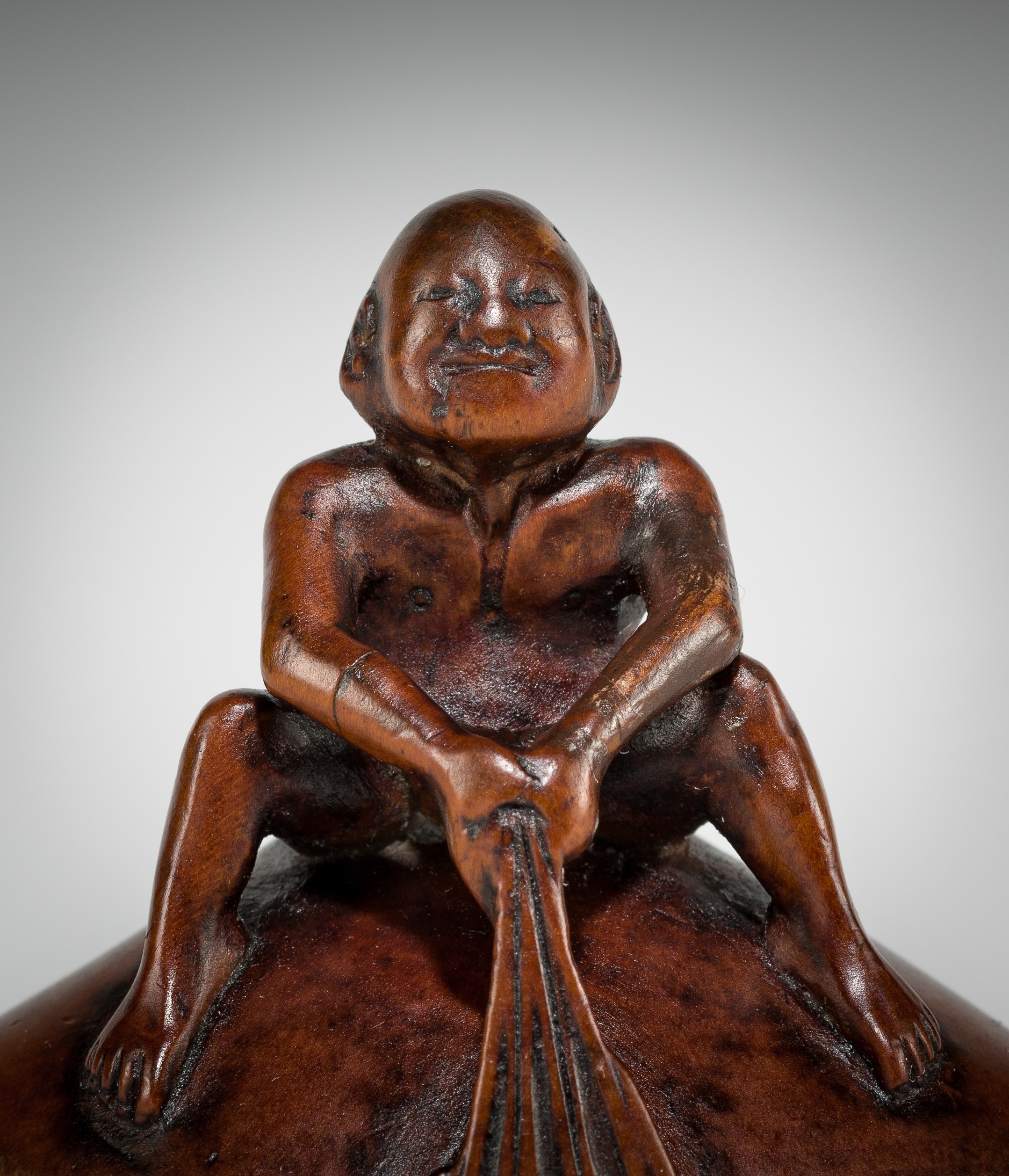 Gyokusai | GYOKUSAI: A FINE WOOD SHUNGA NETSUKE OF MAN ON A HAMAGURI ...