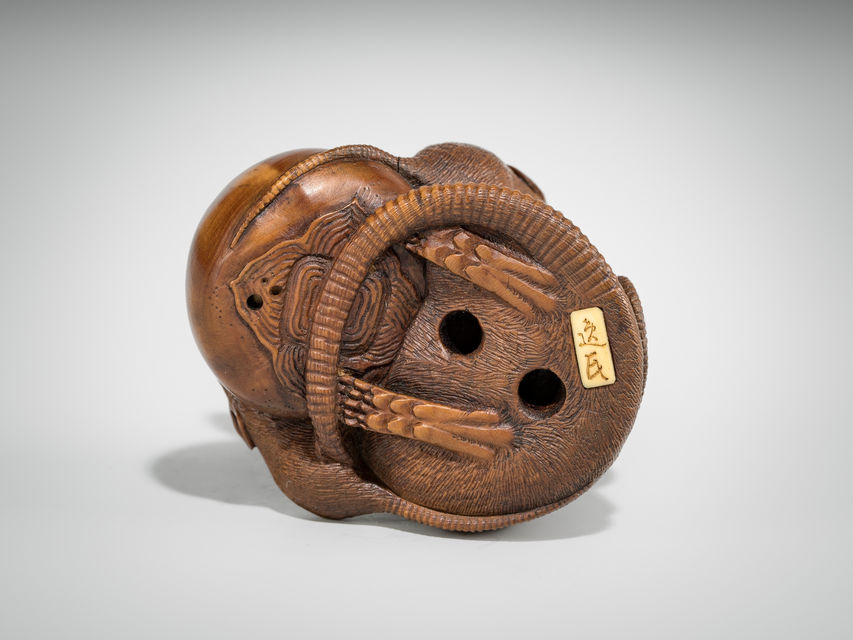 Artwork by Hokyudo Itsumin, ITSUMIN: A FINE WOOD NETSUKE OKIMONO OF A GROUP OF RATS WITH PERSIMMON, Made of wood