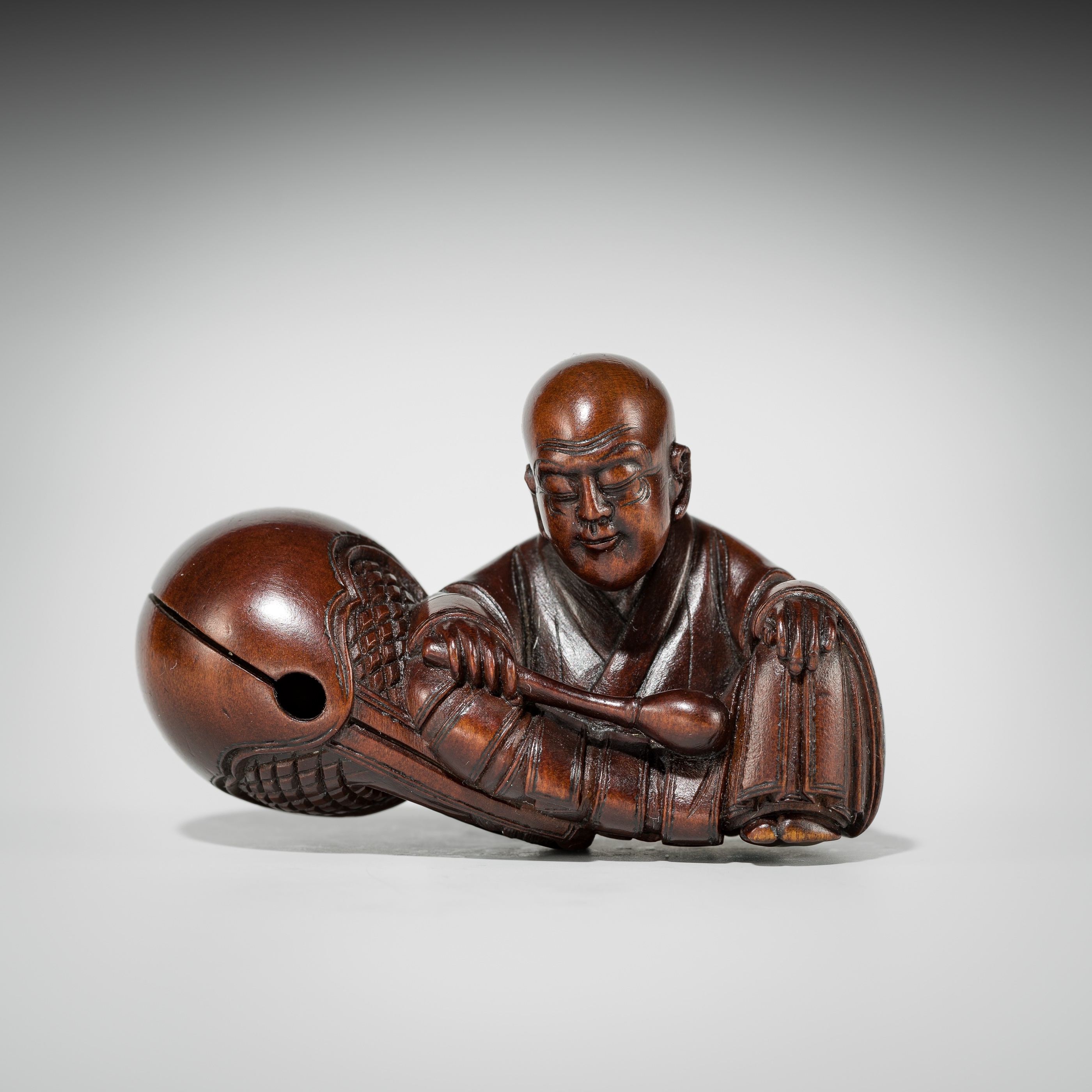 Artwork by Shûmin, SHUMIN: A FINE WOOD NETSUKE OF A MONK WITH MOKUGYO, Made of wood