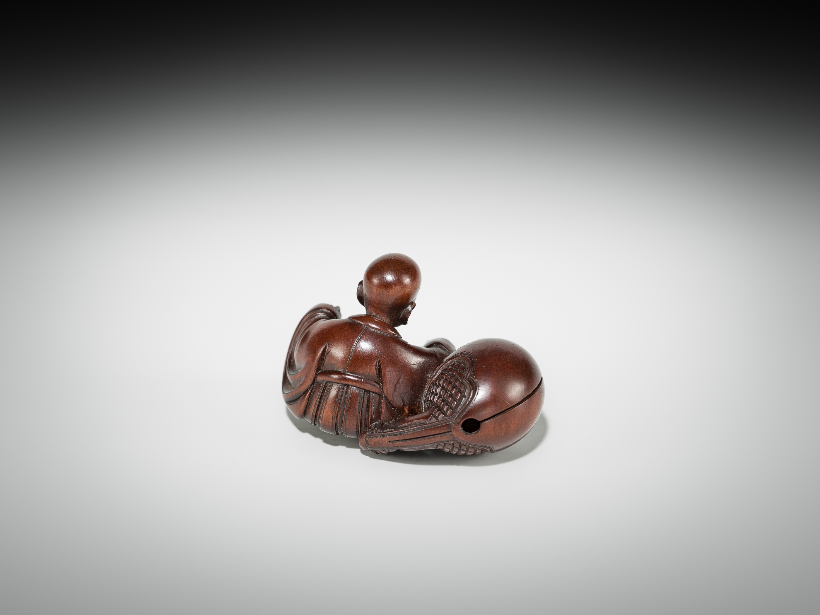 Artwork by Shûmin, SHUMIN: A FINE WOOD NETSUKE OF A MONK WITH MOKUGYO, Made of wood