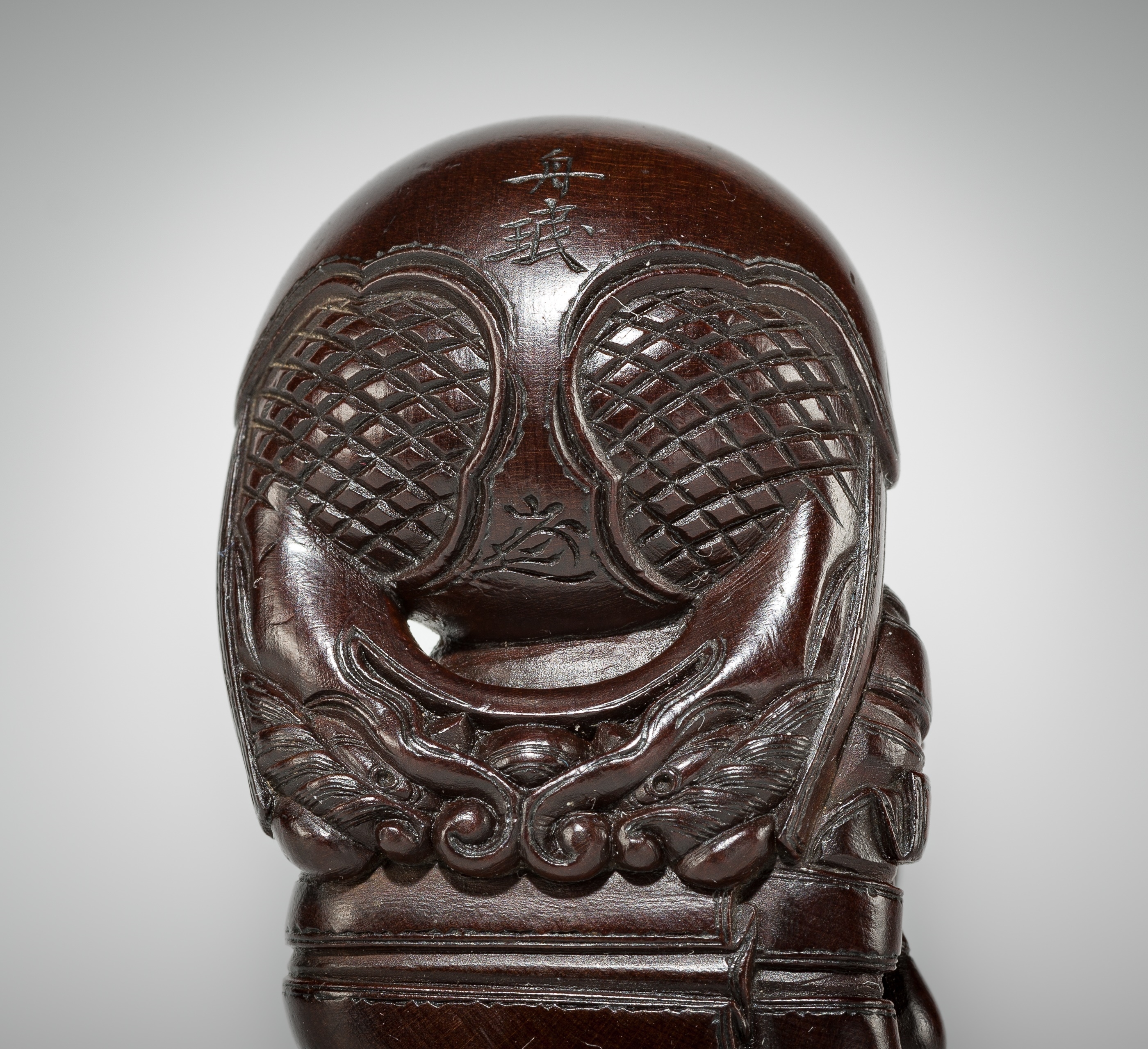 Artwork by Shûmin, SHUMIN: A FINE WOOD NETSUKE OF A MONK WITH MOKUGYO, Made of wood