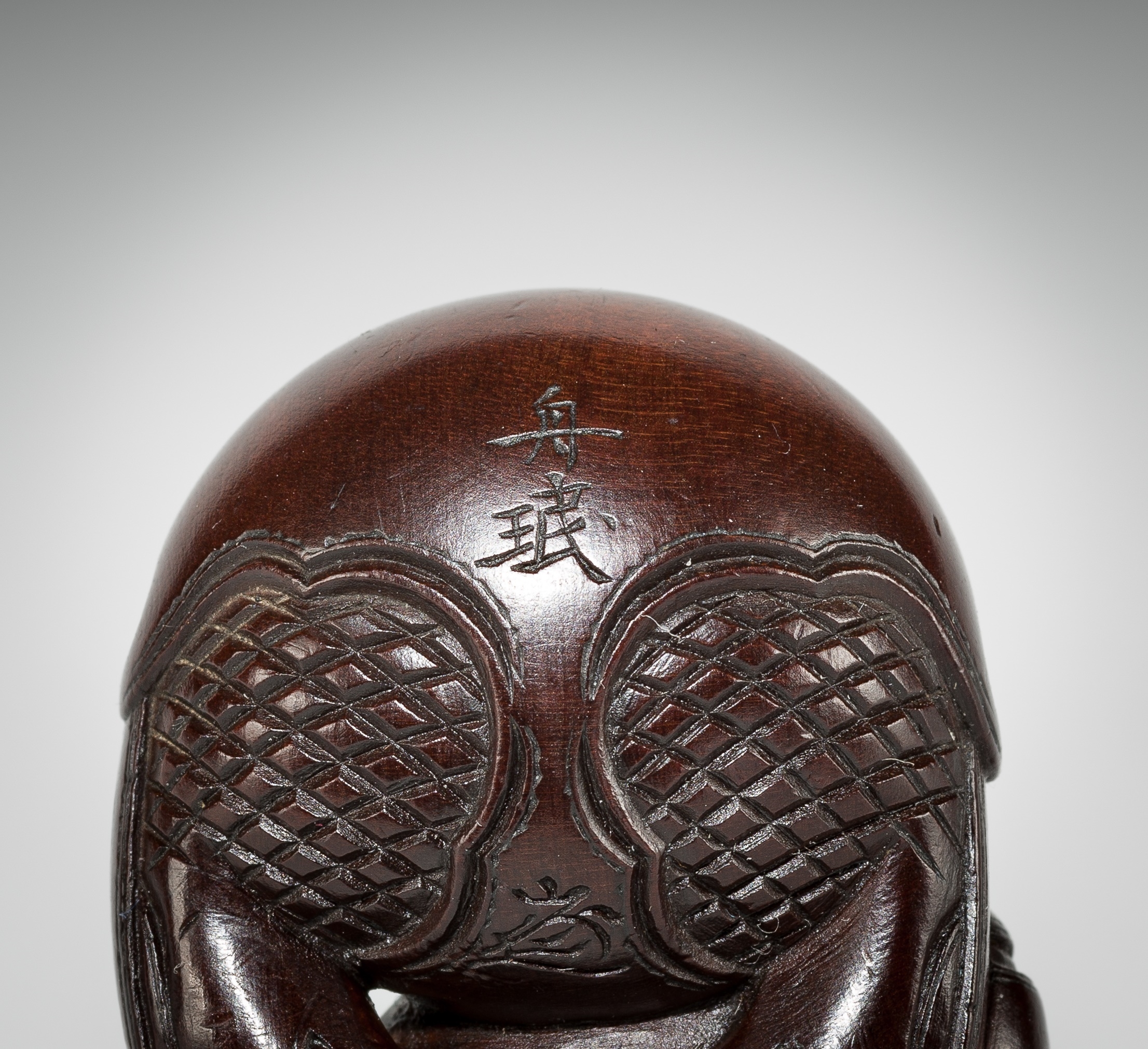 Artwork by Shûmin, SHUMIN: A FINE WOOD NETSUKE OF A MONK WITH MOKUGYO, Made of wood