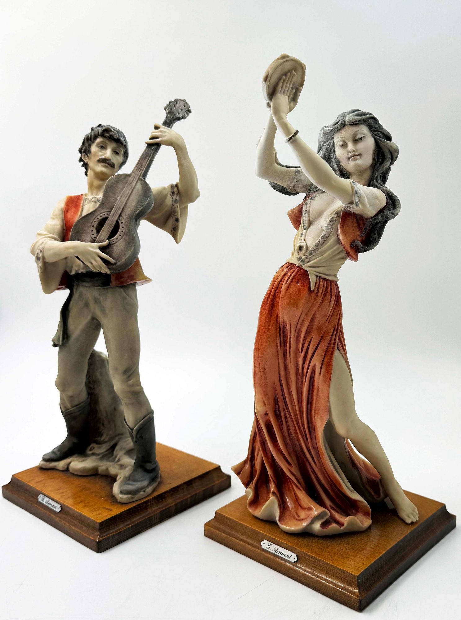 Artwork by Giuseppe Armani, A Rare Pair Of Italian Florence Capodimonte Giuseppe Armani's Gypsy Dancer & Guitarist Matt Hand Painted Porcelain Statues on Wooden bases. Signed by artist, Made of hand painted porcelain