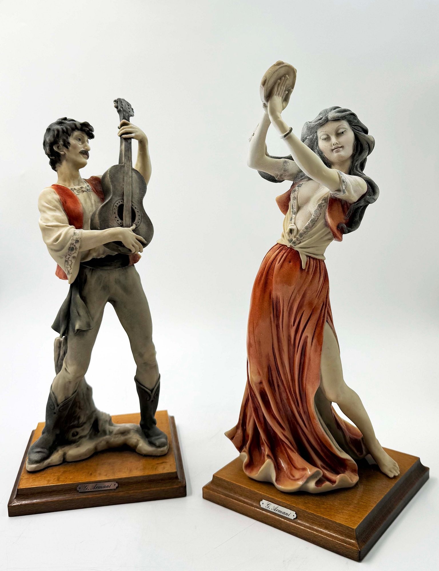 Artwork by Giuseppe Armani, A Rare Pair Of Italian Florence Capodimonte Giuseppe Armani's Gypsy Dancer & Guitarist Matt Hand Painted Porcelain Statues on Wooden bases. Signed by artist, Made of hand painted porcelain
