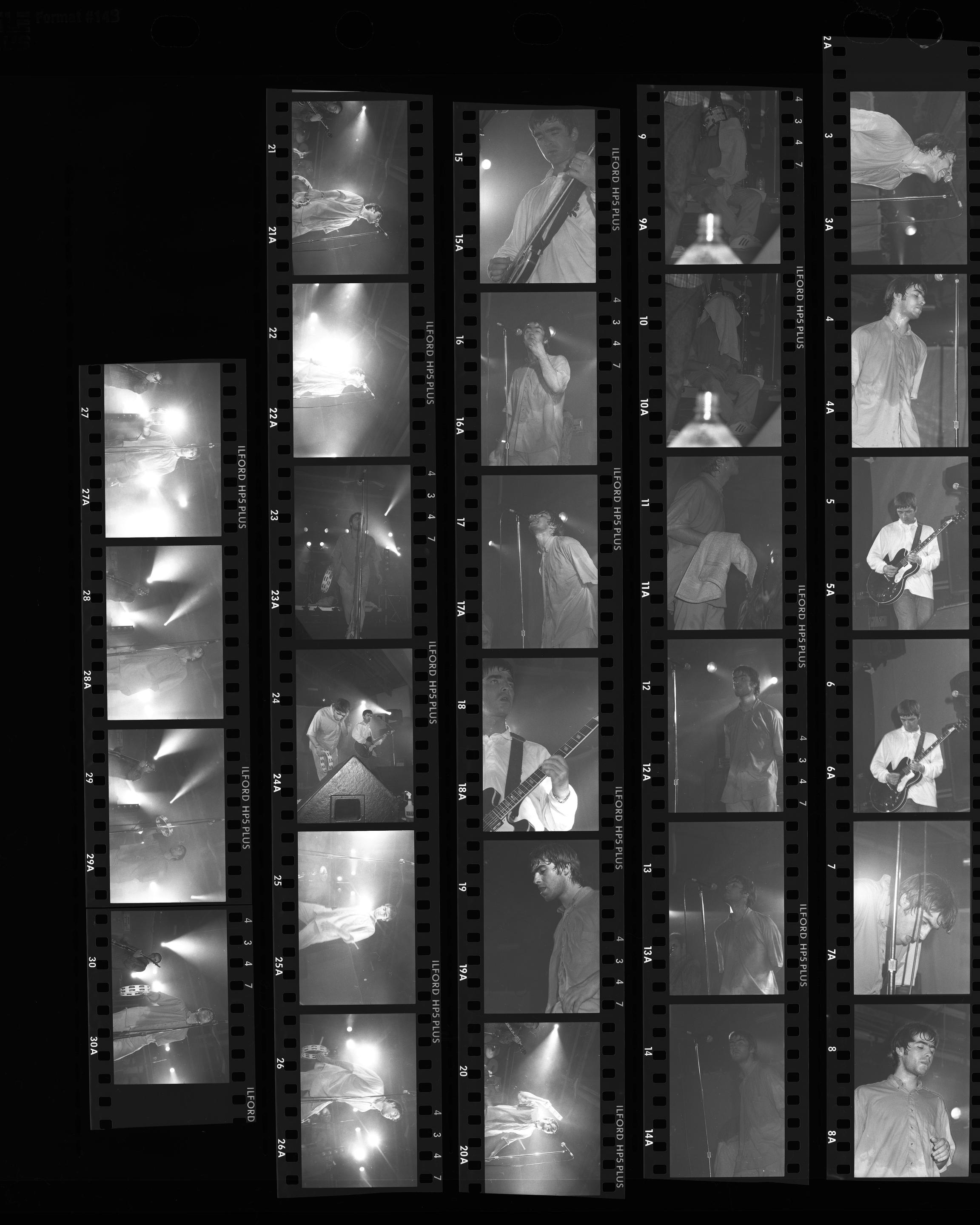 Artwork by Tom Sheehan, Oasis performing at Bath Pavilion, Made of Photographs - Black and white negatives (115); Colour transparencies  (50)