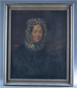 A formal portrait of a woman in dark clothing and a lace bonnet, framed by a silver frame.