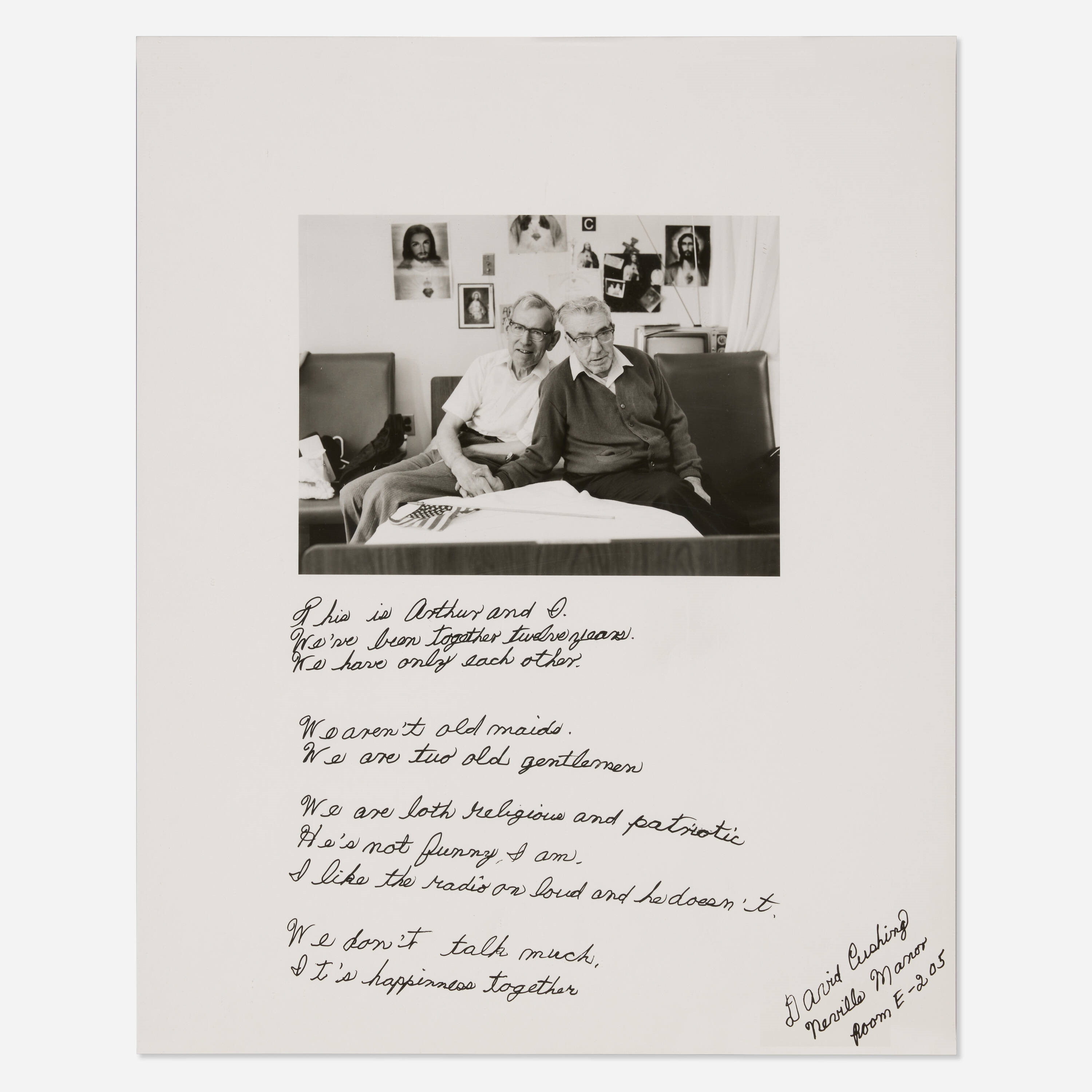 A black-and-white photograph of two elderly figures seated together, accompanied by handwritten text.