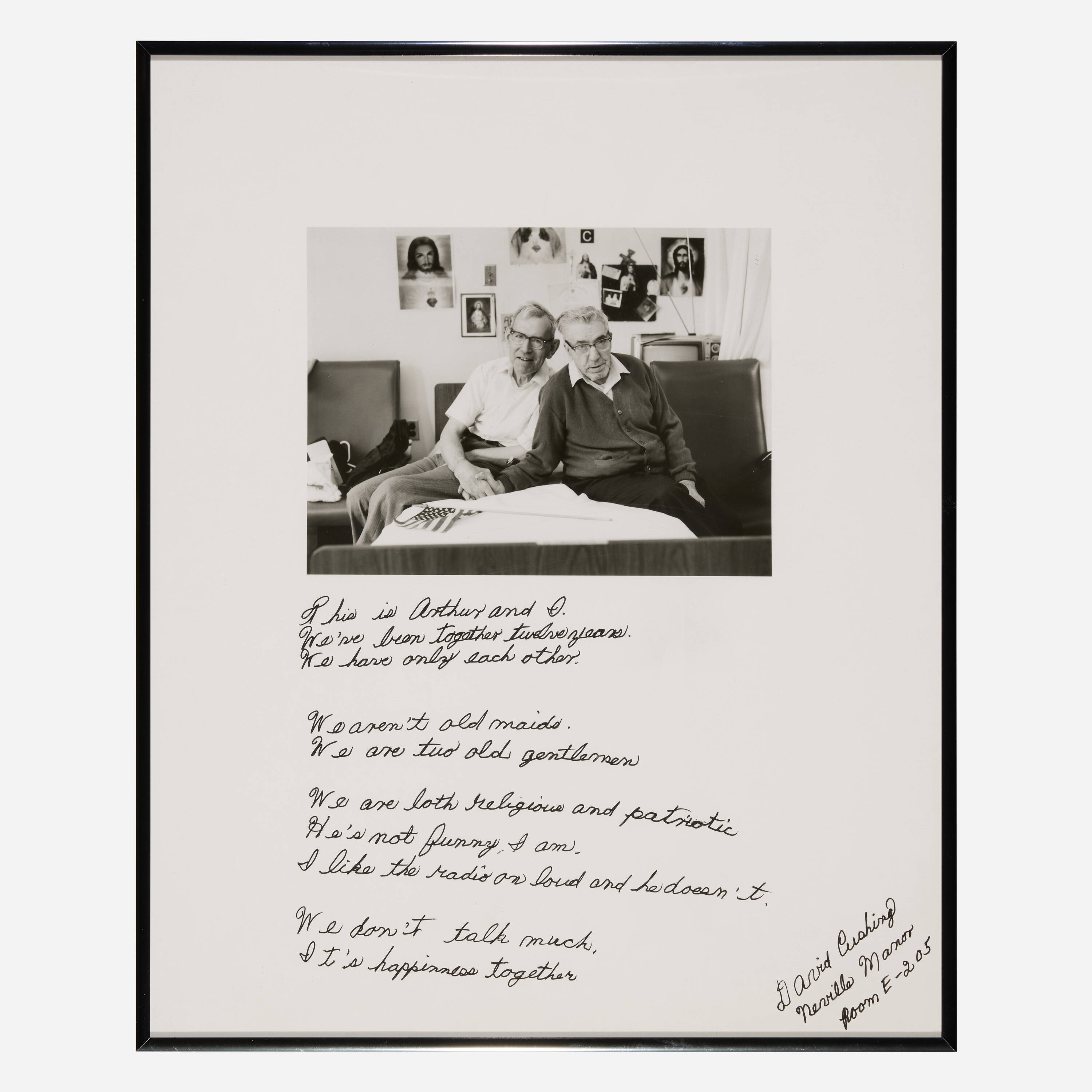 A black-and-white photograph of two elderly figures seated together, accompanied by handwritten text.
