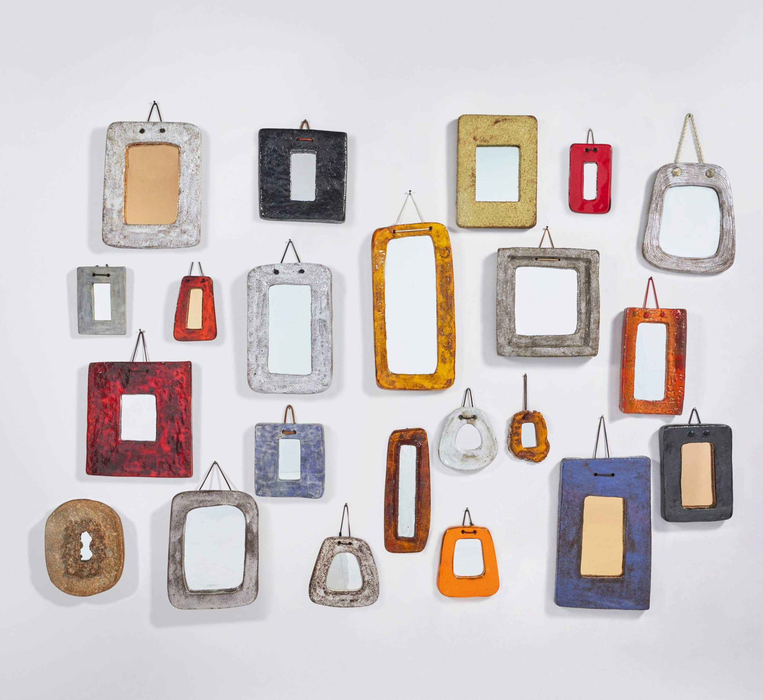 Artwork by Juliette Derel, Group of Twenty-Two Mirrors, Made of glazed ceramic, mirror glass