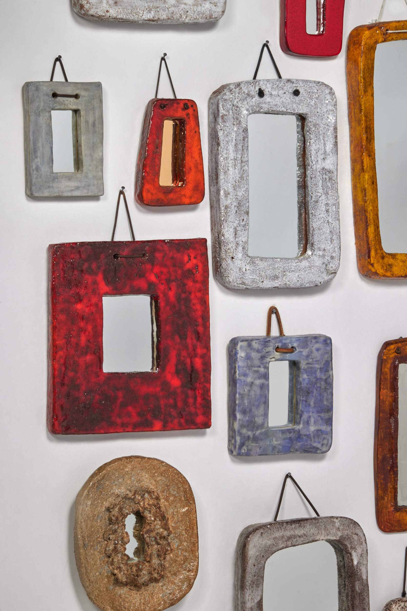 Artwork by Juliette Derel, Group of Twenty-Two Mirrors, Made of glazed ceramic, mirror glass