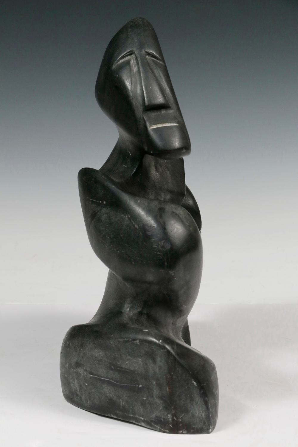 Artwork by Alex Alikashuak, Transformation, Made of carved black soapstone