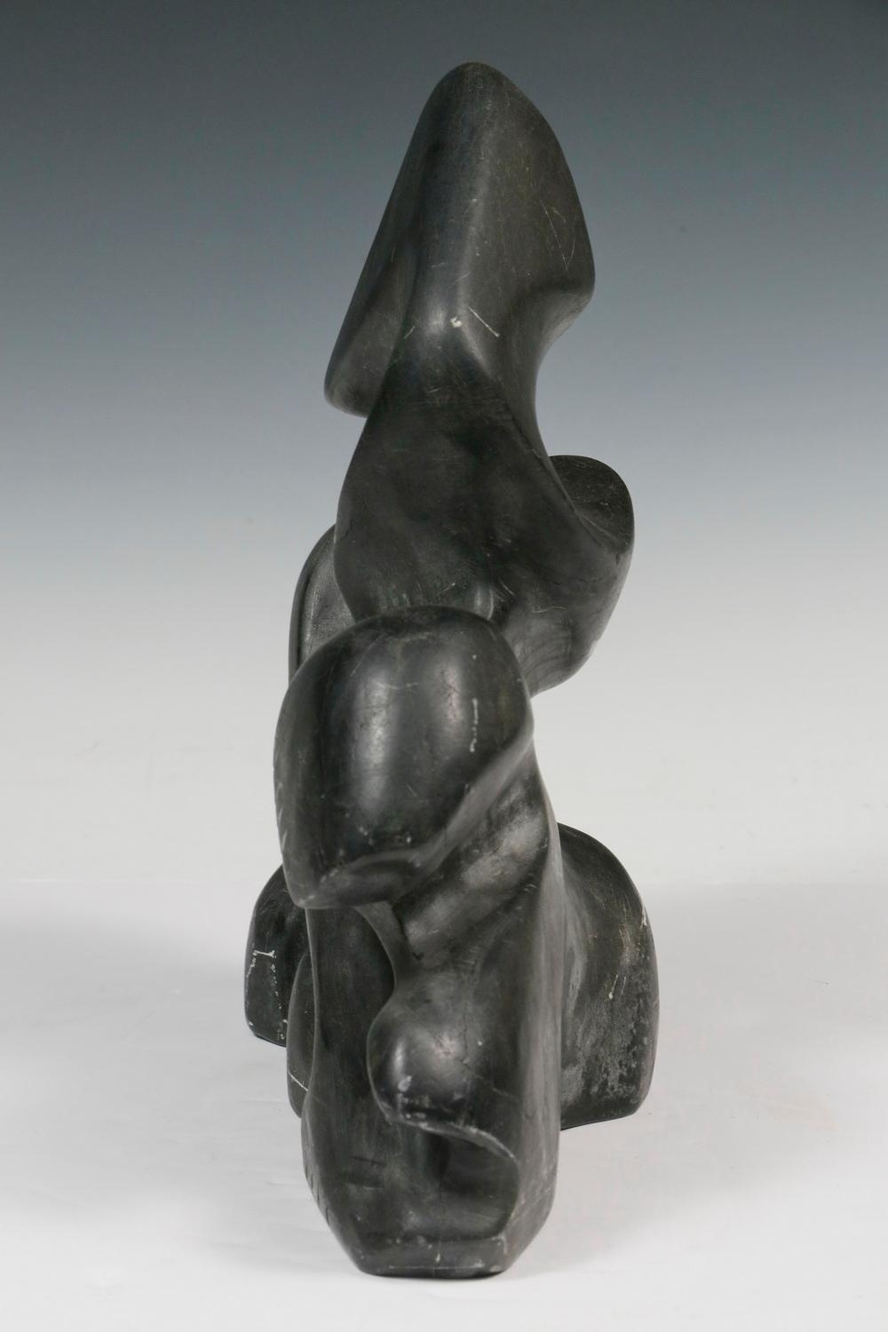 Artwork by Alex Alikashuak, Transformation, Made of carved black soapstone