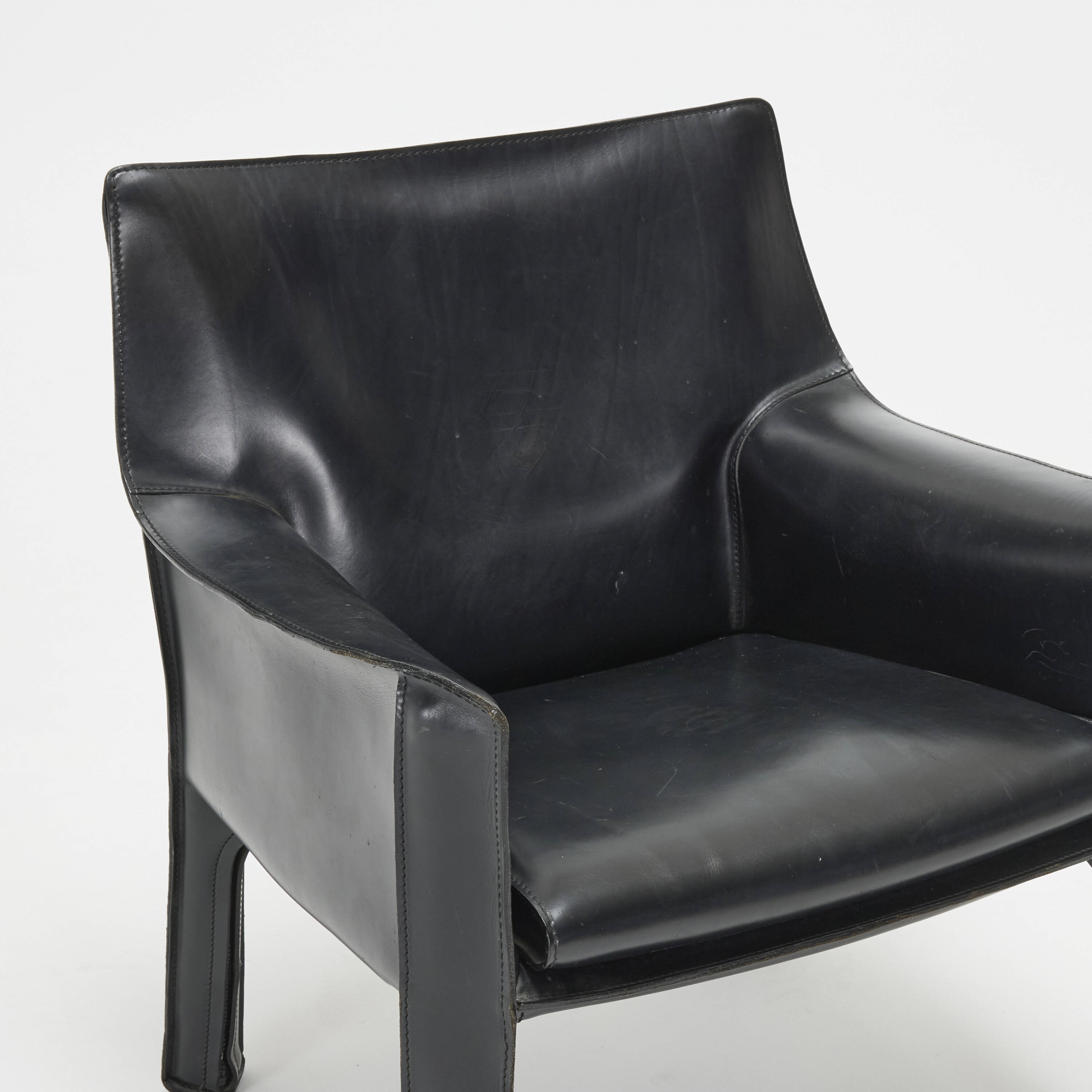 Artwork by Mario Bellini, Cab lounge chair, model 413, Made of leather over enameled steel, plastic