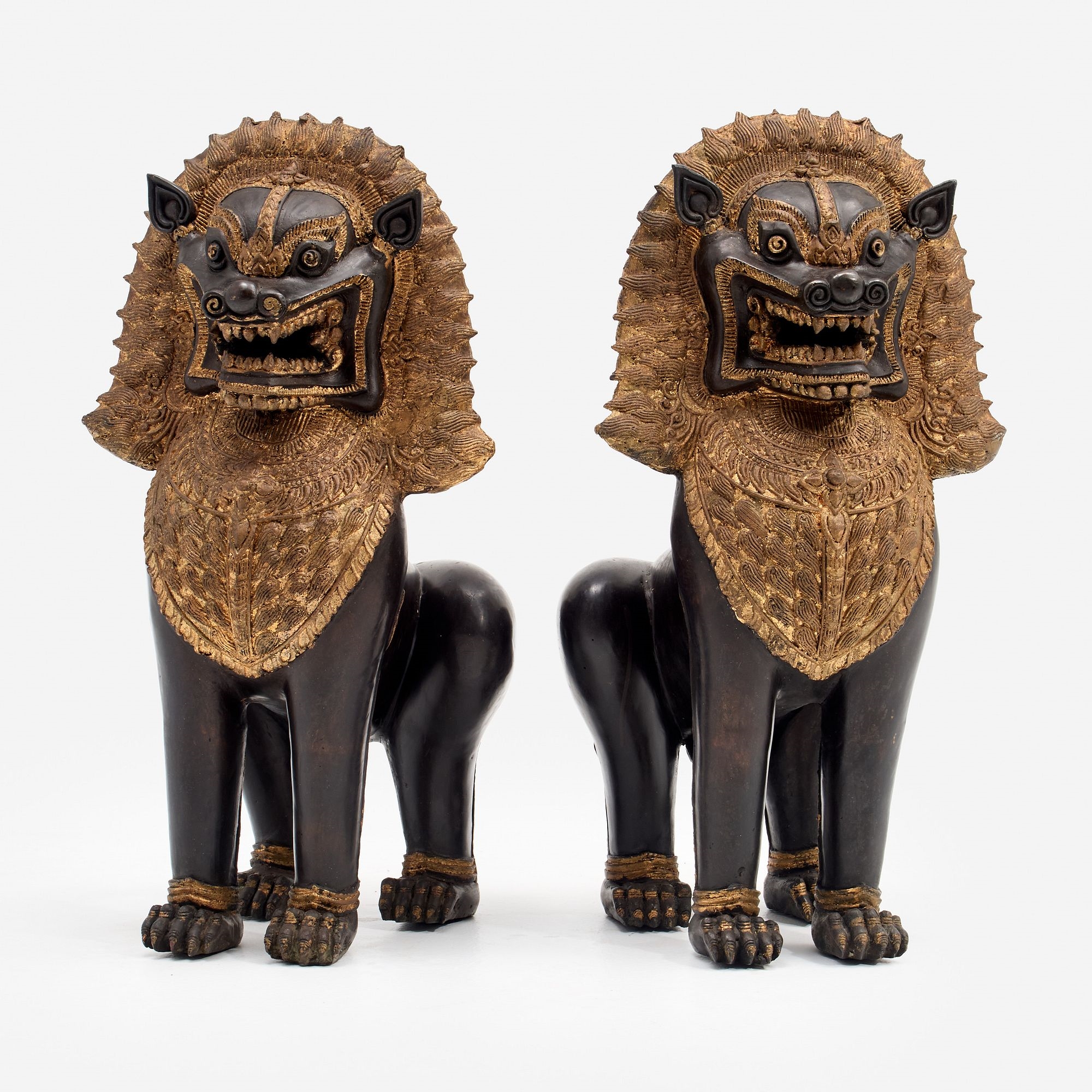 Artwork by Cambodian School, 20th Century, singha temple guardians (foo dogs), Made of mixed bronze having gold-patinated manes and bracelets