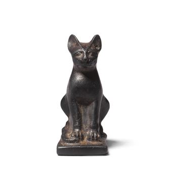 An Egyptian haematite amulet of a seated cat - Egyptian School