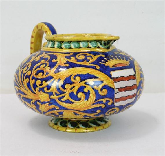 Polychrome earthenware jug with handle decorated with a white and red striped coat of arms, crowned by Ulysse Besnard, 1866